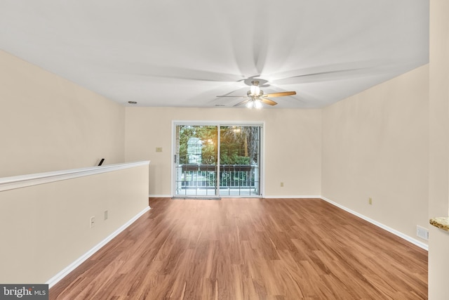 spare room featuring ceiling fan and light wood-type flooring