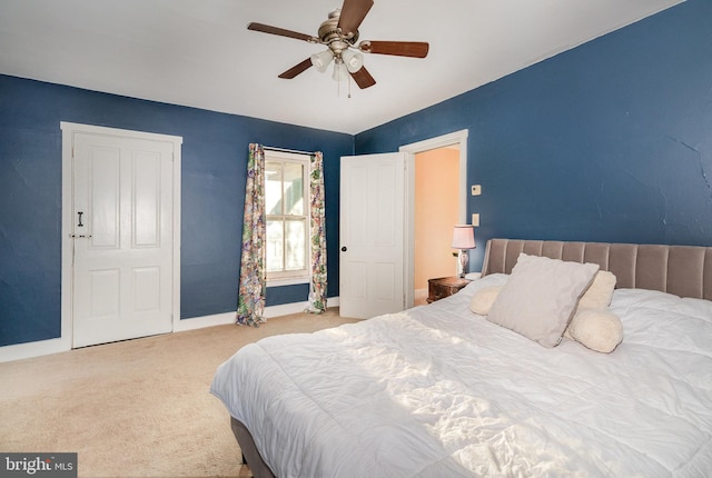 bedroom with ceiling fan and carpet floors