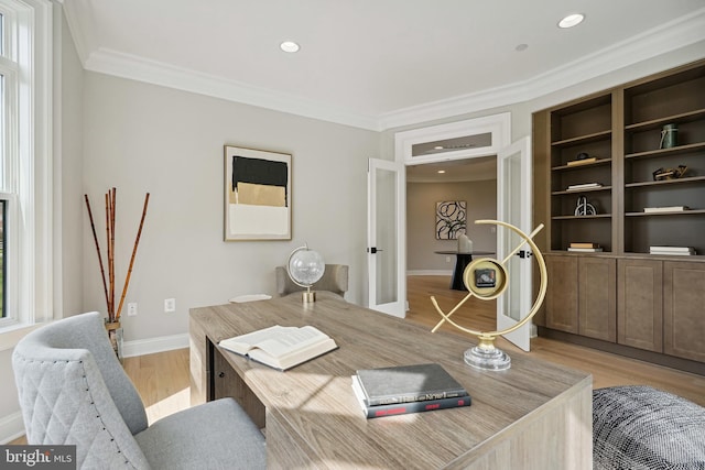 office area featuring french doors, ornamental molding, and light hardwood / wood-style floors