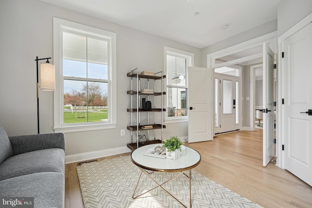 living area featuring hardwood / wood-style floors