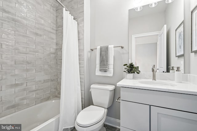 full bathroom with toilet, vanity, and shower / bath combo with shower curtain