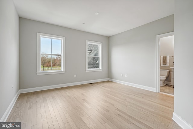 spare room with light hardwood / wood-style floors