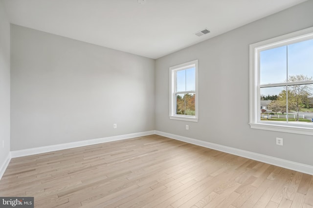 unfurnished room featuring light wood-type flooring