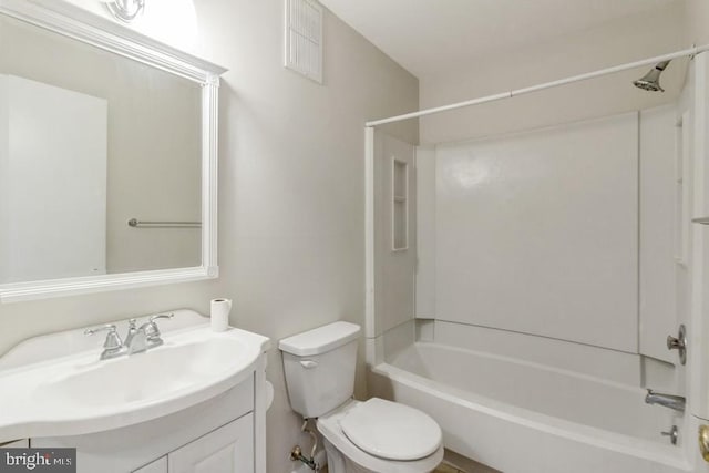 full bathroom with toilet, vanity, and shower / bath combination