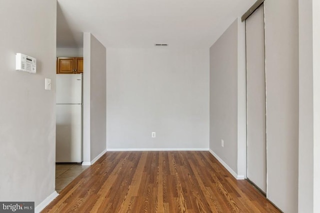 interior space with dark hardwood / wood-style flooring