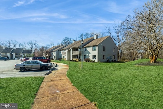 view of side of home with a lawn