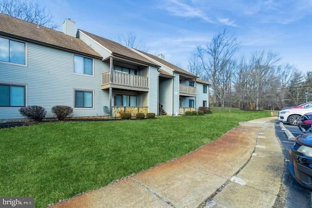 view of property exterior featuring a yard