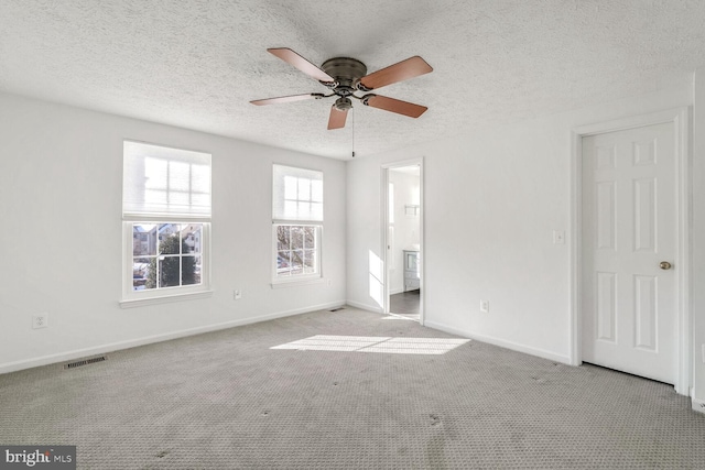 interior space featuring ceiling fan and a textured ceiling