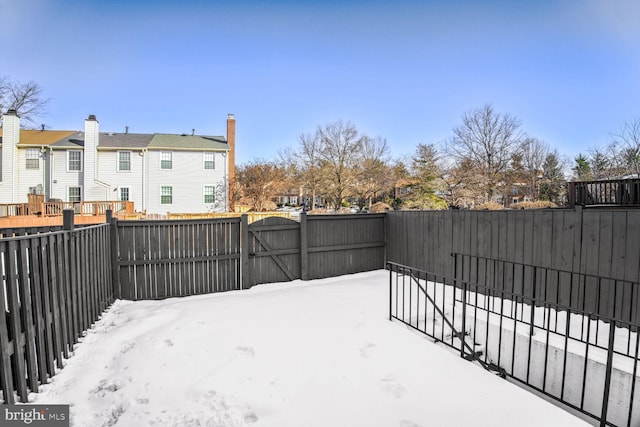 view of yard covered in snow