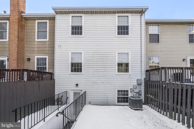 back of property featuring cooling unit