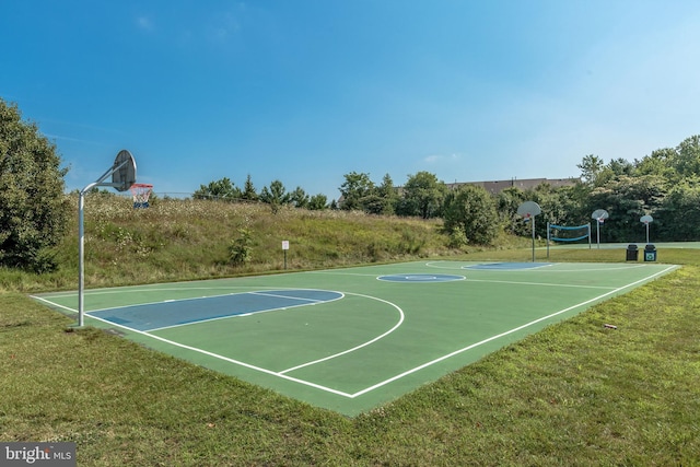 view of sport court featuring a yard