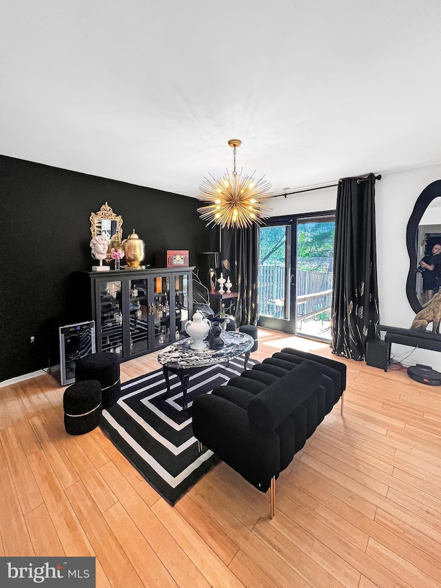 living room featuring hardwood / wood-style floors and a notable chandelier