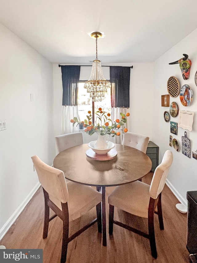 dining space featuring a chandelier