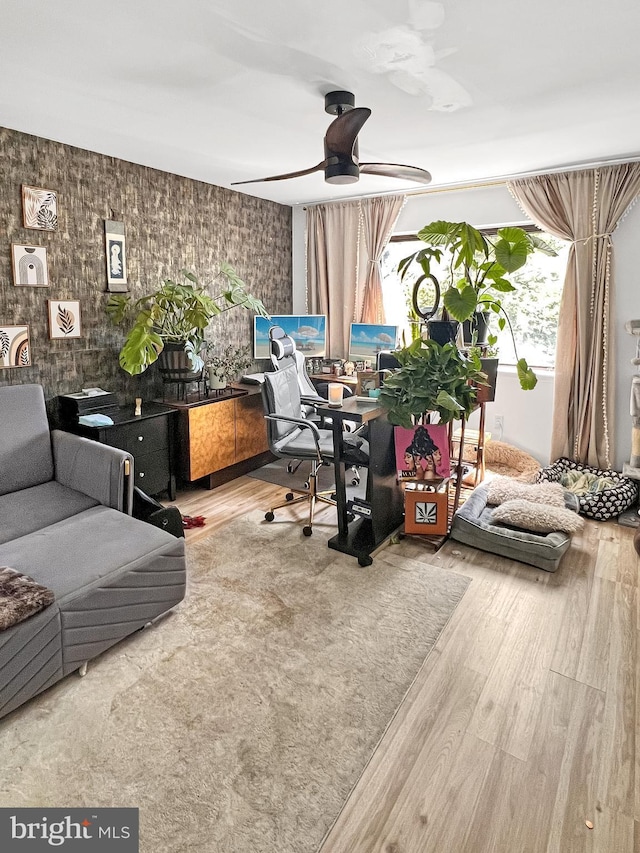 interior space featuring ceiling fan and hardwood / wood-style flooring