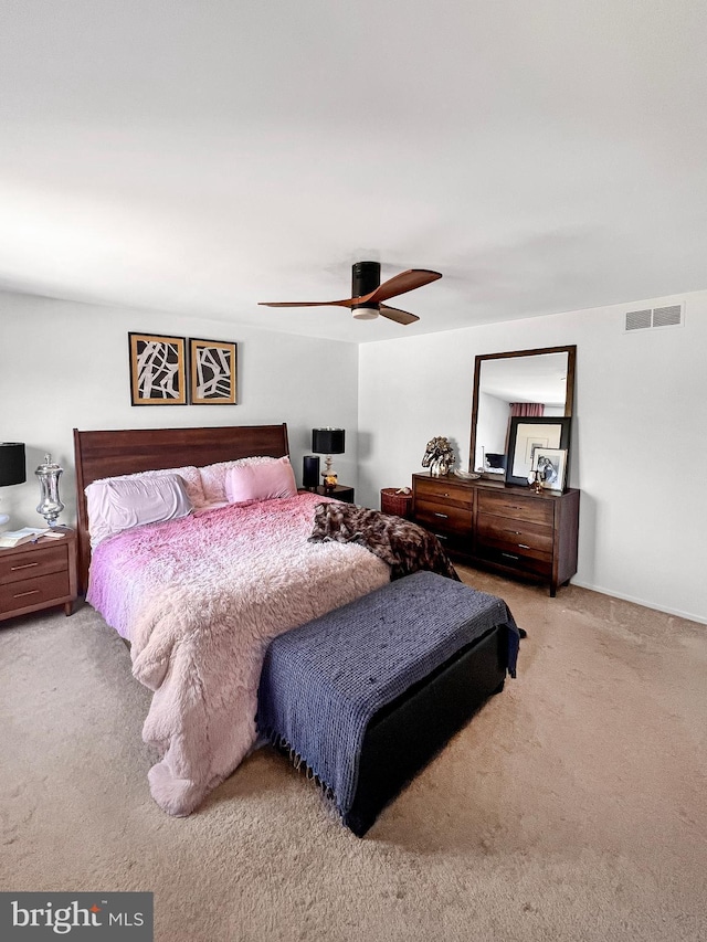 carpeted bedroom with ceiling fan