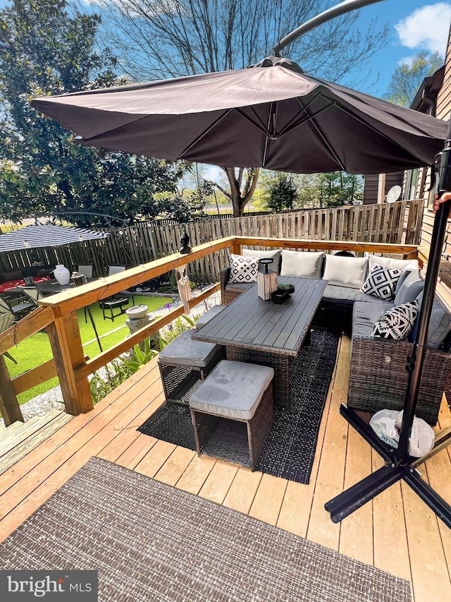 deck featuring outdoor lounge area