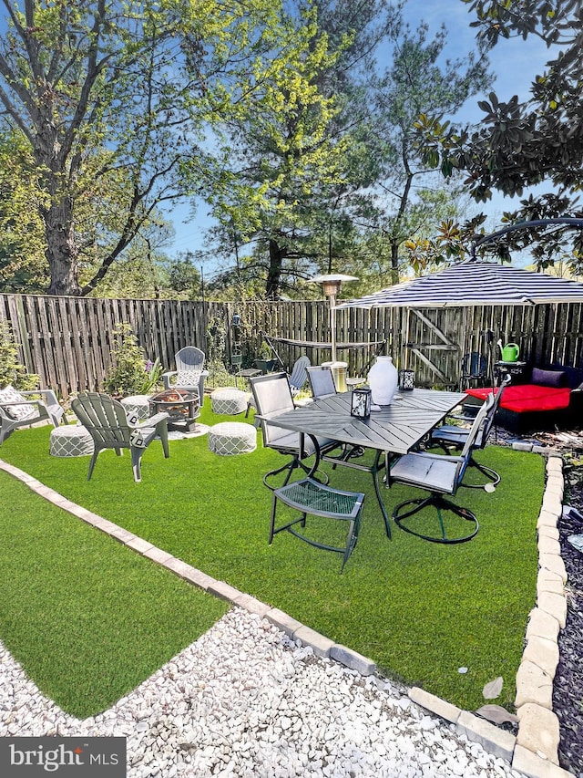 view of yard with an outdoor fire pit