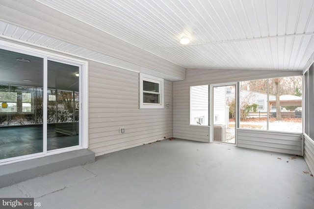 unfurnished sunroom with vaulted ceiling