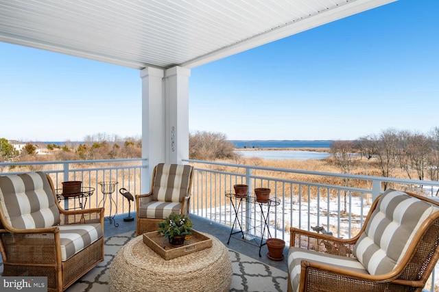 balcony featuring a water view