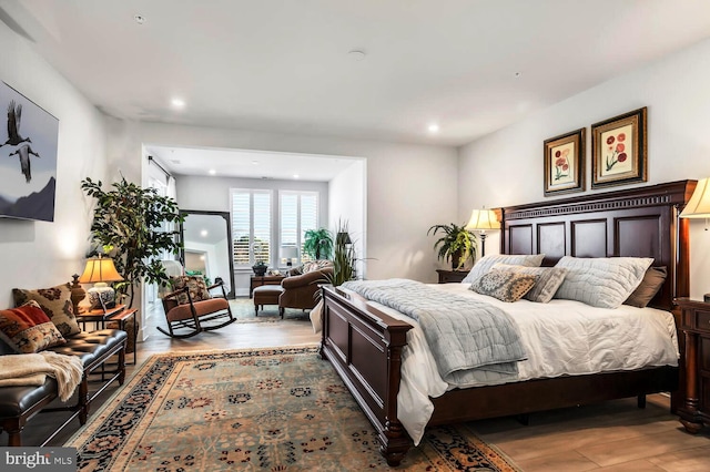 bedroom featuring wood-type flooring