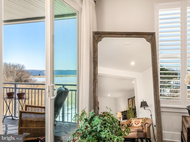 balcony featuring a water view