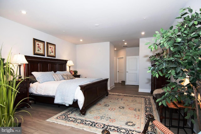 bedroom featuring dark wood-type flooring