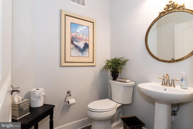 bathroom with toilet and sink