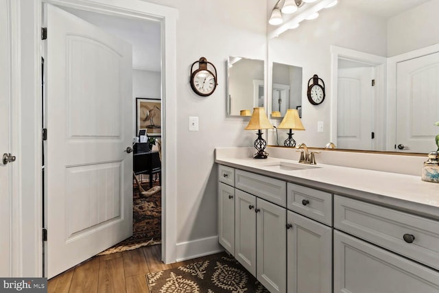 bathroom with hardwood / wood-style flooring and vanity