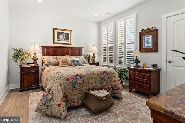 bedroom featuring light hardwood / wood-style floors