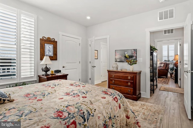 bedroom featuring light hardwood / wood-style floors