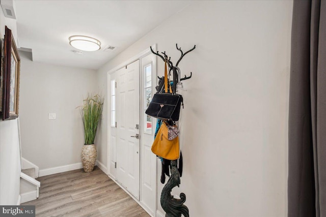 foyer with light hardwood / wood-style floors