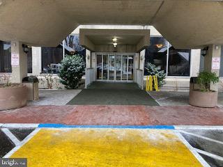 entrance to property with a carport