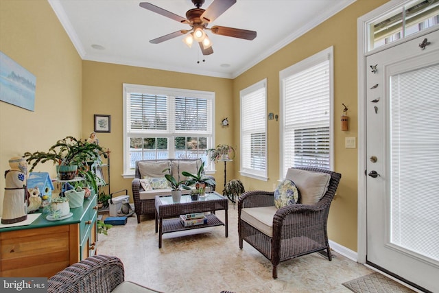 sitting room featuring ceiling fan, light tile patterned floors, and crown molding