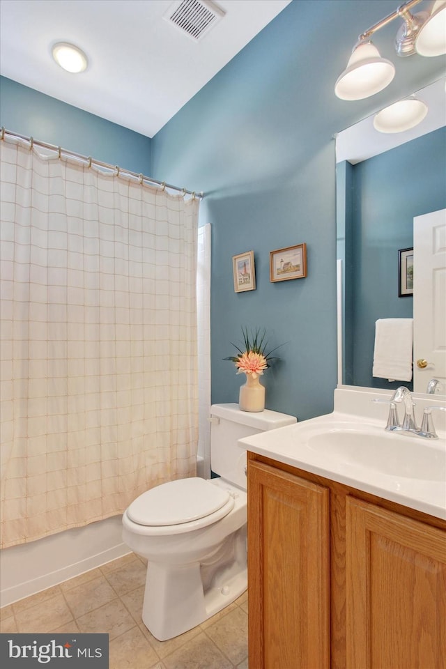 full bathroom with toilet, vanity, tile patterned floors, and shower / bath combo with shower curtain