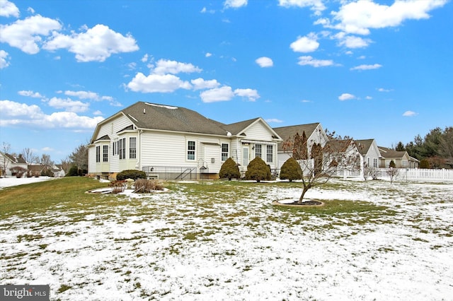 view of front of house with a yard