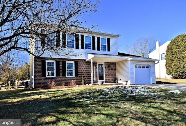 view of front property with a garage and a front lawn