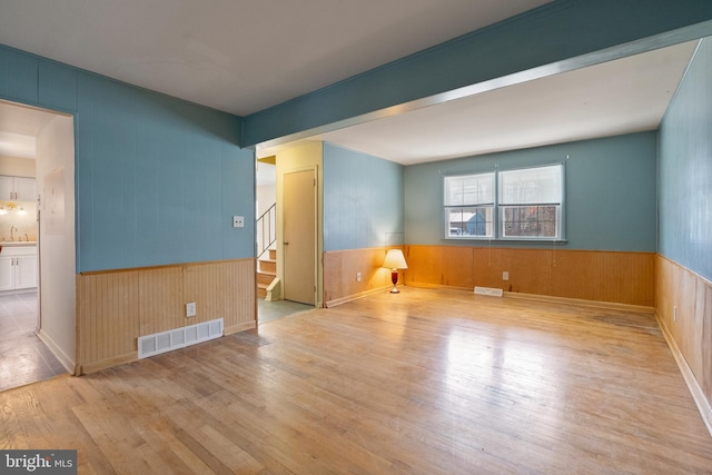 spare room with light wood-type flooring