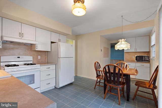 kitchen with white cabinets, hanging light fixtures, and white appliances