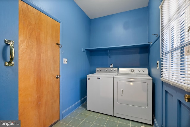 clothes washing area featuring separate washer and dryer