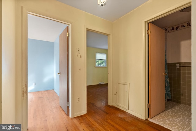 hallway featuring light hardwood / wood-style flooring