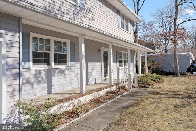 property entrance featuring covered porch