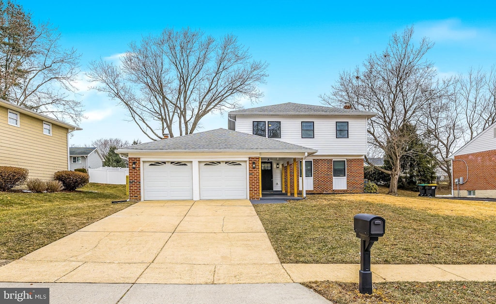 front of property with a front lawn and a garage