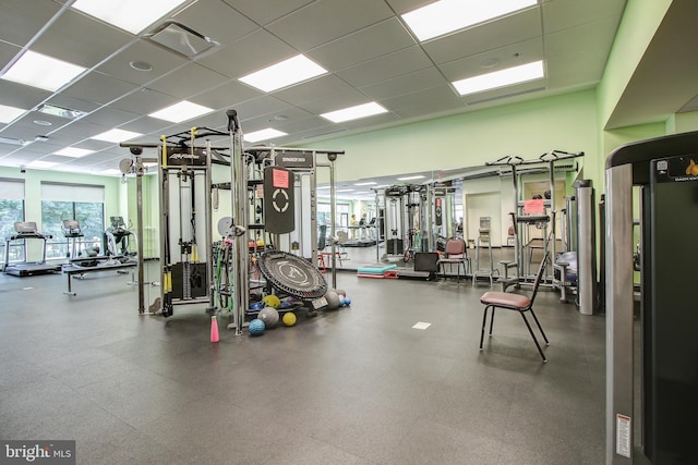 exercise room featuring a drop ceiling