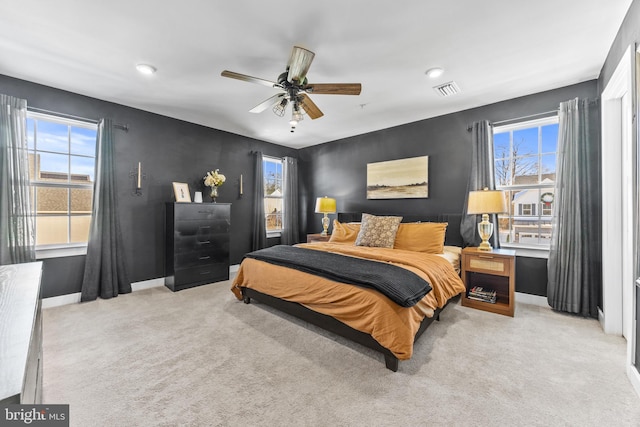 bedroom with light colored carpet and ceiling fan