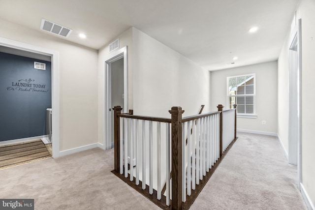 hallway with light carpet