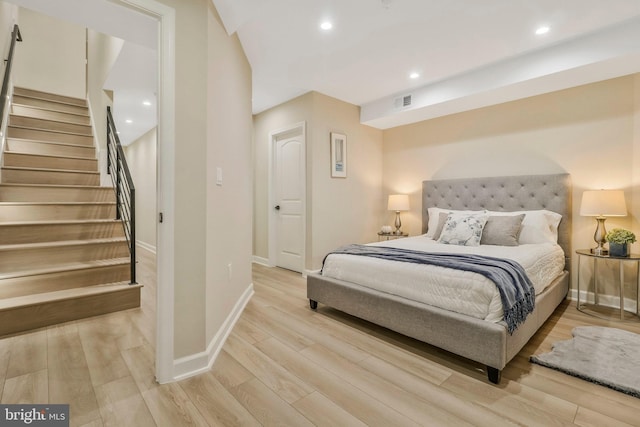 bedroom with light wood-type flooring