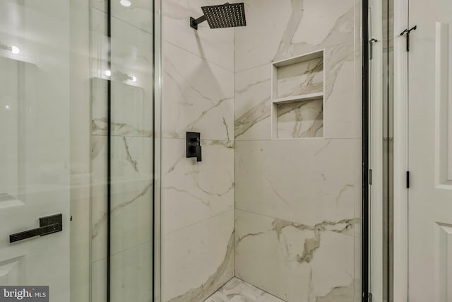 bathroom with a tile shower