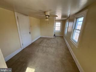 unfurnished room with ceiling fan