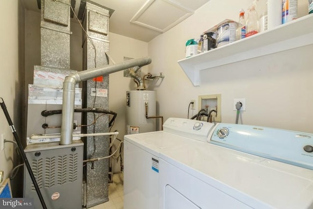 washroom featuring water heater, washing machine and clothes dryer, and heating unit