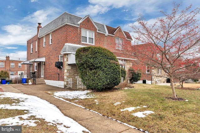 view of front of home with a yard